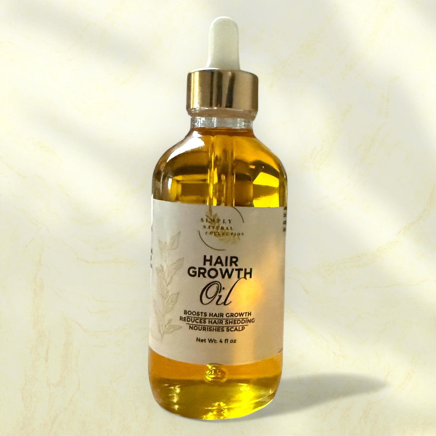 Hair growth oil bottle with dropper on a light background