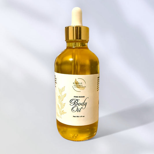 Bottle of pink sugar body oil with a dropper on a light gray background