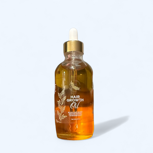 Bottle of hair growth oil with a dropper on a white background